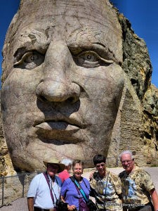 Phyllis and Larry with friends Robert and Cassandra on the arm on the Crazy Horse Monument