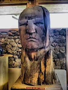 Portrait of Crazy Horse in wood.